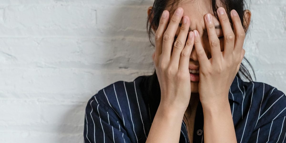 A person looking deeply tired, illustrating the fatigue and brain fog that follows anxiety.