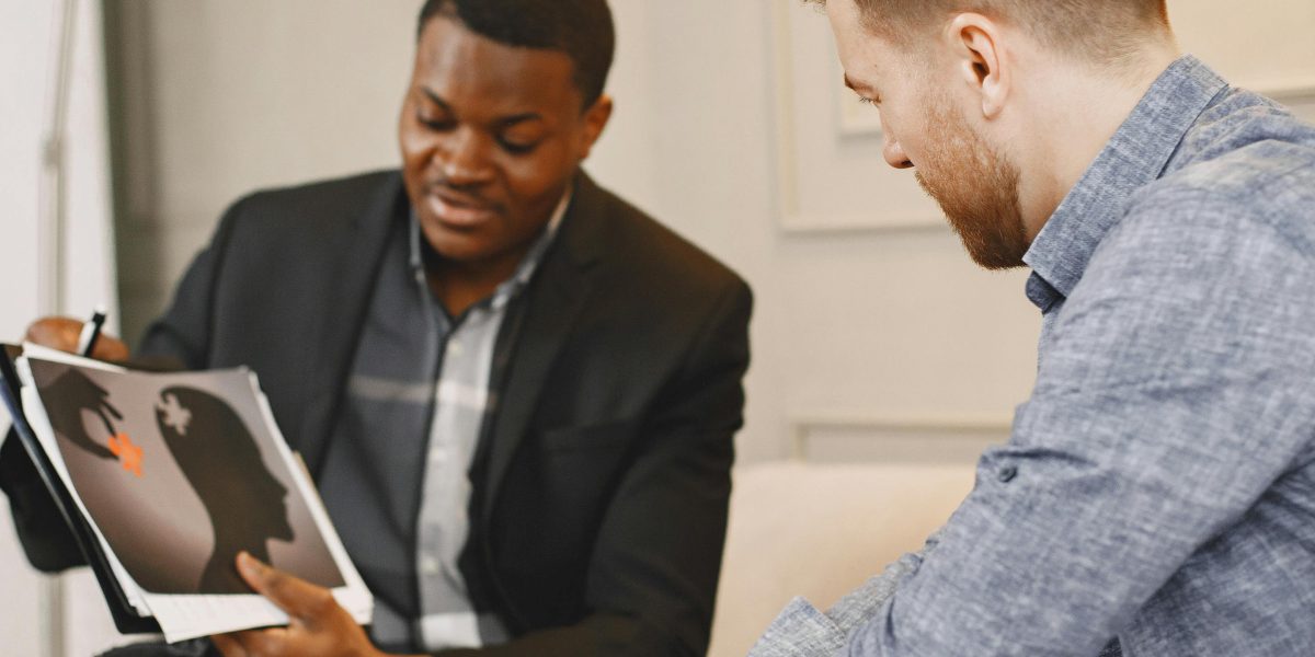 A client actively engaging in a discussion with a therapist, embodying the collaborative nature of CBT.