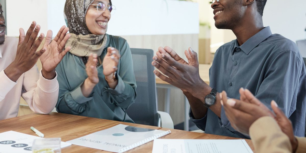 A diverse group of individuals engaging in a supportive conversation, representing the value of peer support in recovery.