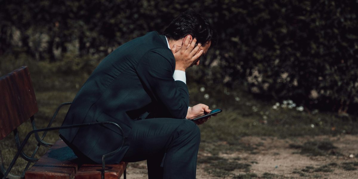 A person looking thoughtful and somewhat overwhelmed, illustrating the confusion between everyday stress and severe anxiety.