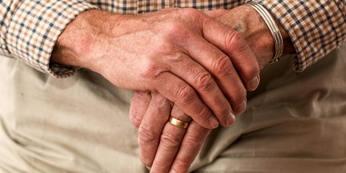 A person engaged in a supportive conversation with a counselor or therapist, representing follow-up care and planning for future well-being.