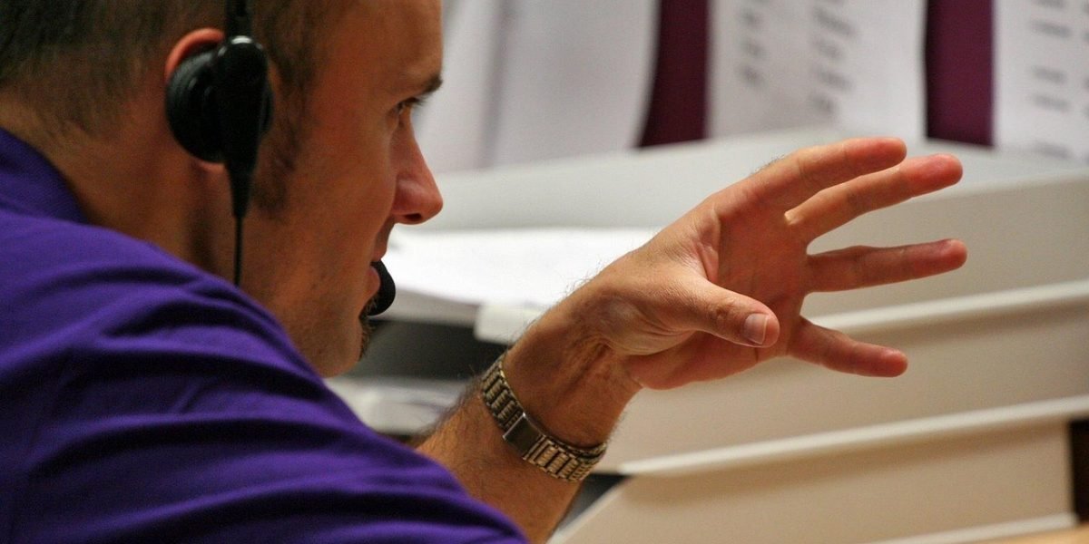 A person speaking openly and confidently to a supportive counselor in a comfortable setting.