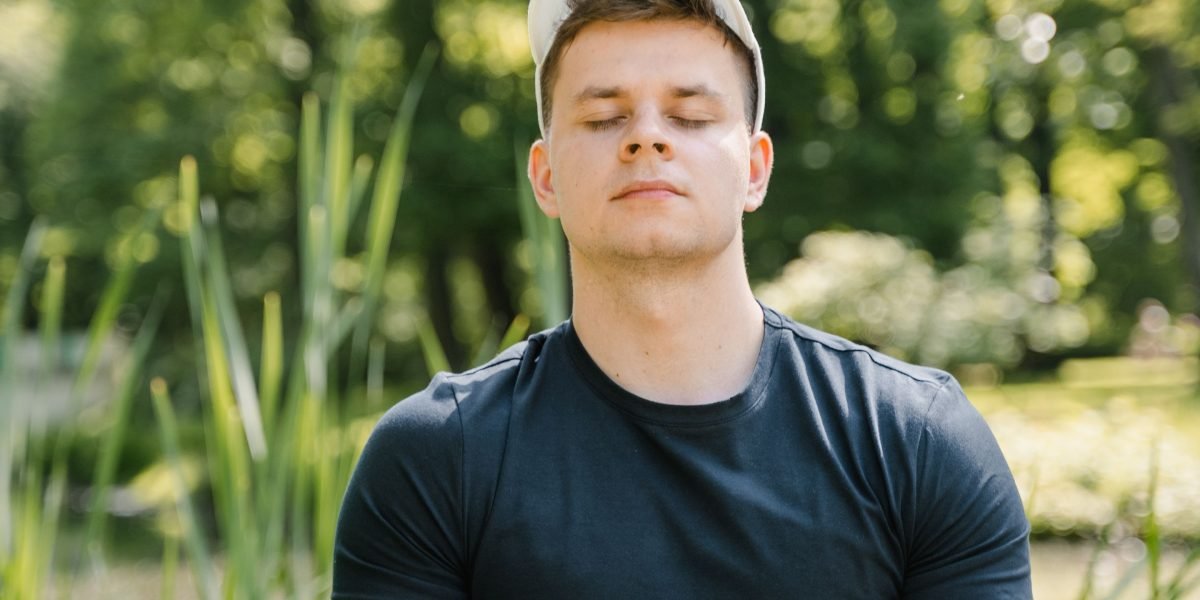 A person in a calm setting, practicing meditation, embodying a sense of peace and tranquility.