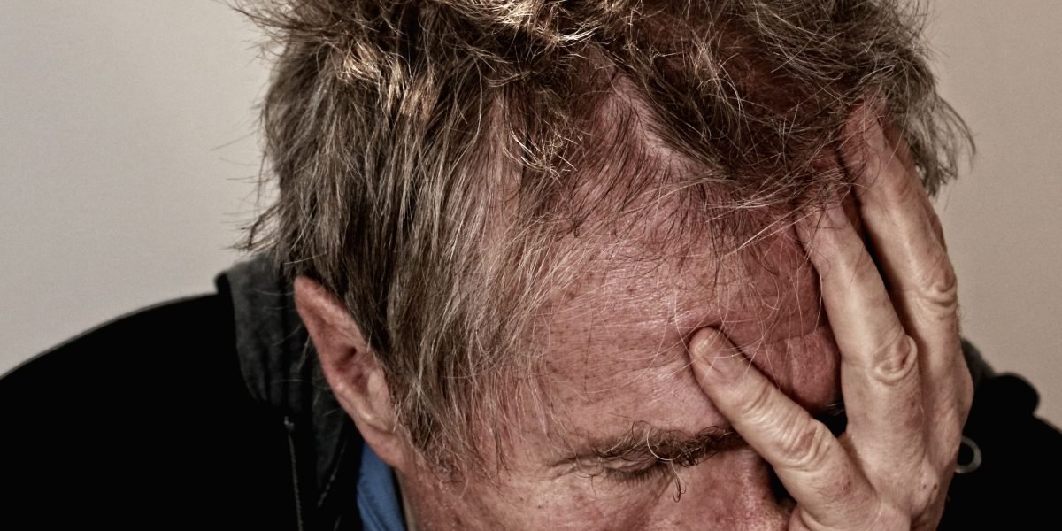 A person appearing introspective or overwhelmed, symbolizing the profound impact of depression on daily life.