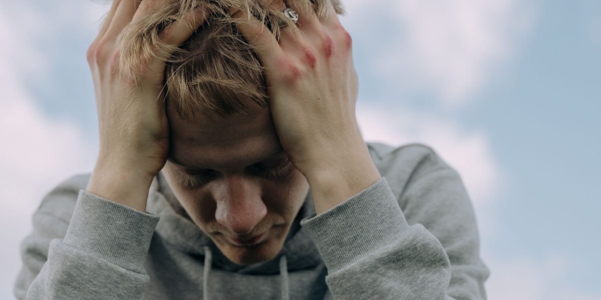 A person looking deeply thoughtful, conveying a sense of being overwhelmed by complex decisions.