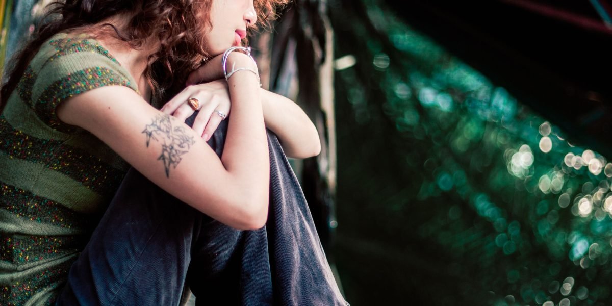 A person lost in thought, conveying the internal struggle and discomfort of anxiety.
