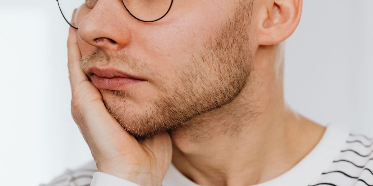 A person appearing worried or restless, reflecting the common internal experience of anxiety and unease.