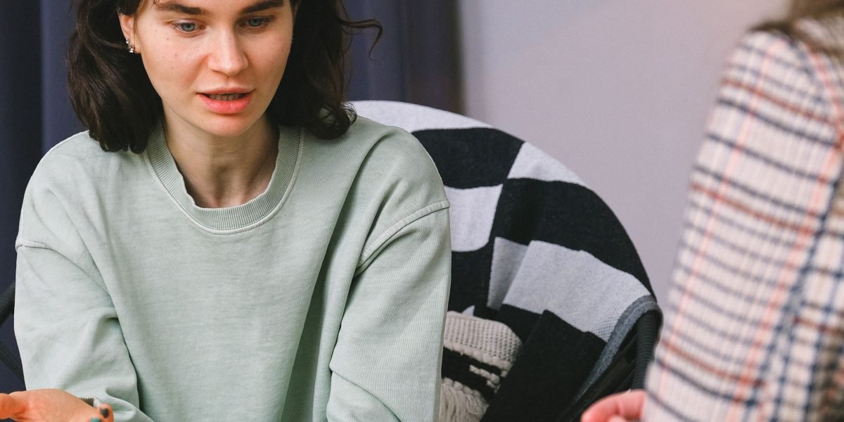 A person consulting with a mental health professional, representing the important step of seeking professional help for anxiety.