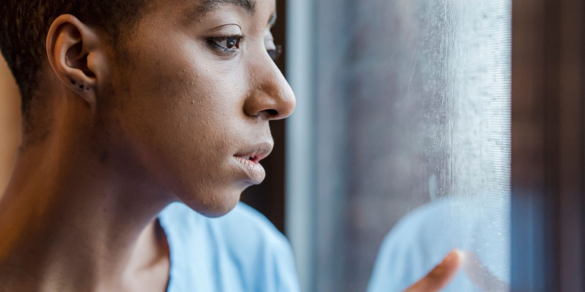 A person looking thoughtful or concerned, reflecting the emotional impact of diagnostic labels and the potential for stigma.